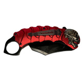 Navaja plegable tipo karambit con diseño de calavera y clip — imagen 3 de 4