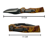 Navaja plegable drop point con acabado camuflado y clip metálico — imagen 2 de 3