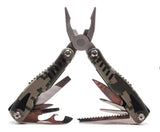 Pinza multiherramienta plegable 14 en 1 sobre mesa de trabajo — imagen 1 de 4