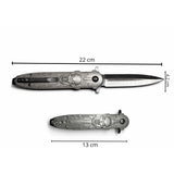 Navaja plegable metálica con acabado tipo calavera y empuñadura ergonómica — imagen 4 de 5