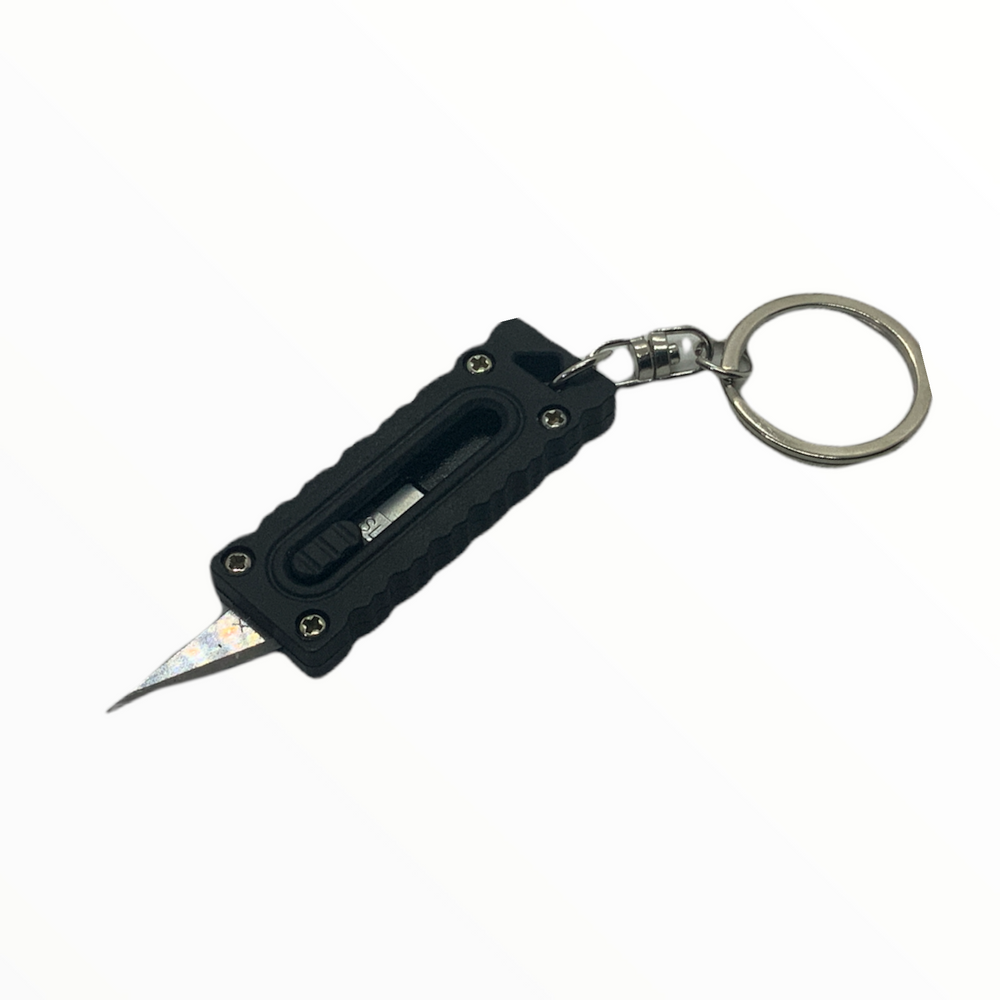 Mini cutter en formato de llavero para defensa personal