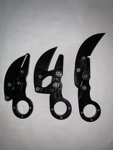 Cuchillo tipo karambit retráctil con hoja que se guarda en el mango — imagen 1 de 2