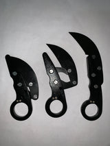 Cuchillo tipo karambit retráctil con hoja que se guarda en el mango — imagen 2 de 2