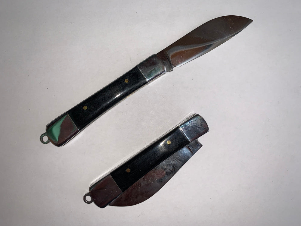 Navaja plegable con mango de mica plástica y madera